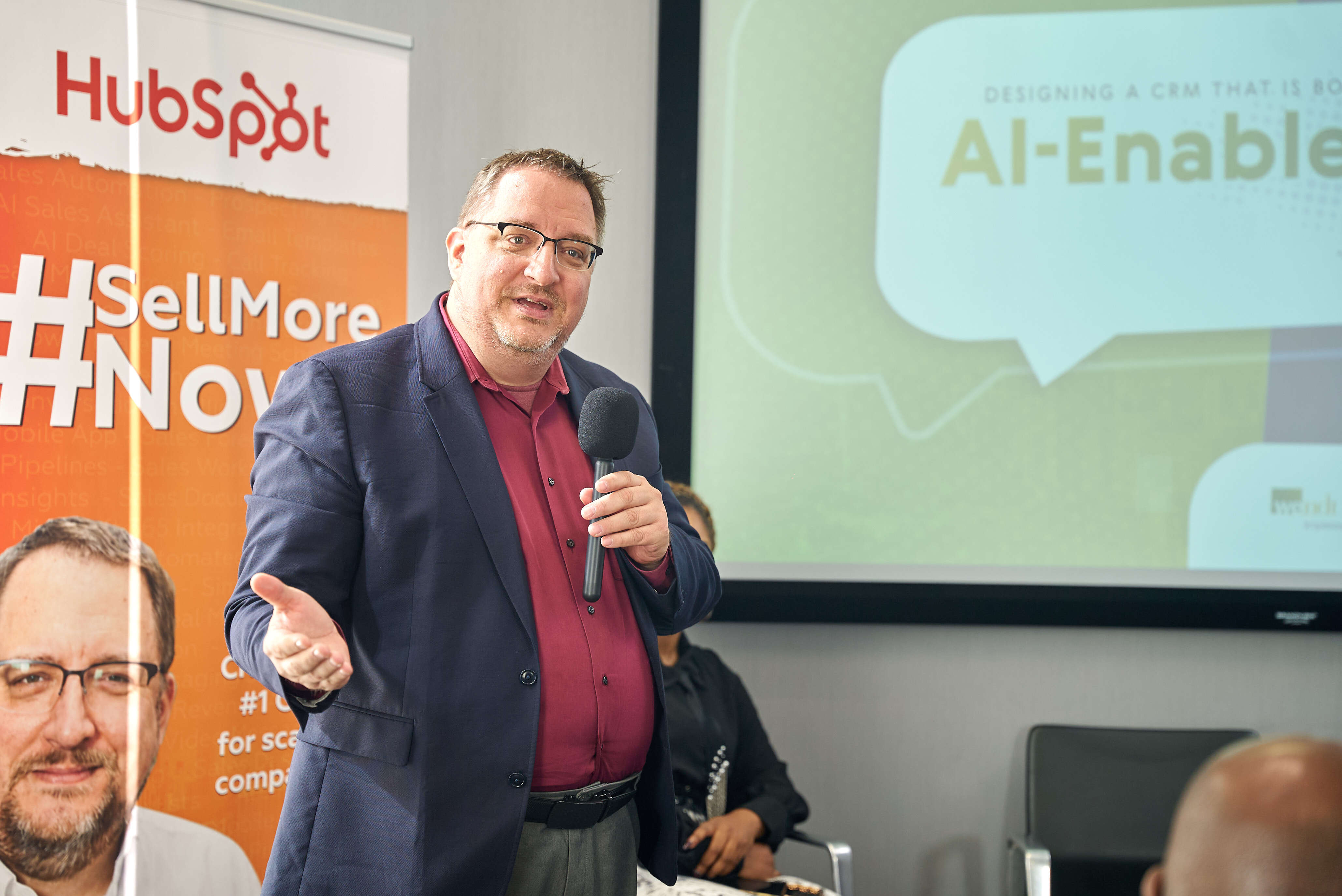 Sell More Now event presenter speaking to attendees